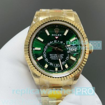 Swiss copy yellow gold Rolex Sky-Dweller 2nd time zone green dial watch 42mm 